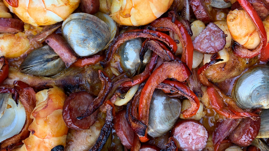 Pipis with chorizo, capsicum and prawns